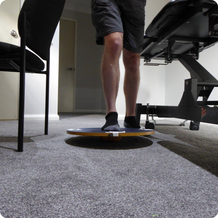 Proprioceptive ankle rehab mounting the board one leg supported